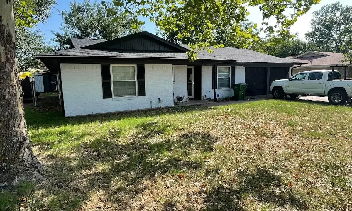 Professional roofing crew working on a residential roof in Waterville